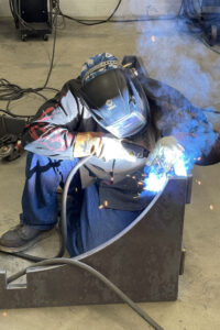 person welding